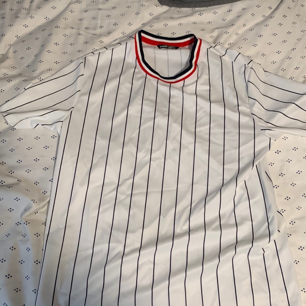 From Shein, with a black,red,white, and blue on the shirt. It’s is medium size